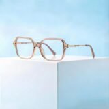 Women's oversized square prescription glasses with transparent pink TR90 frame, gold metal hinges, lightweight myopia eyewear for daily fashion wear.